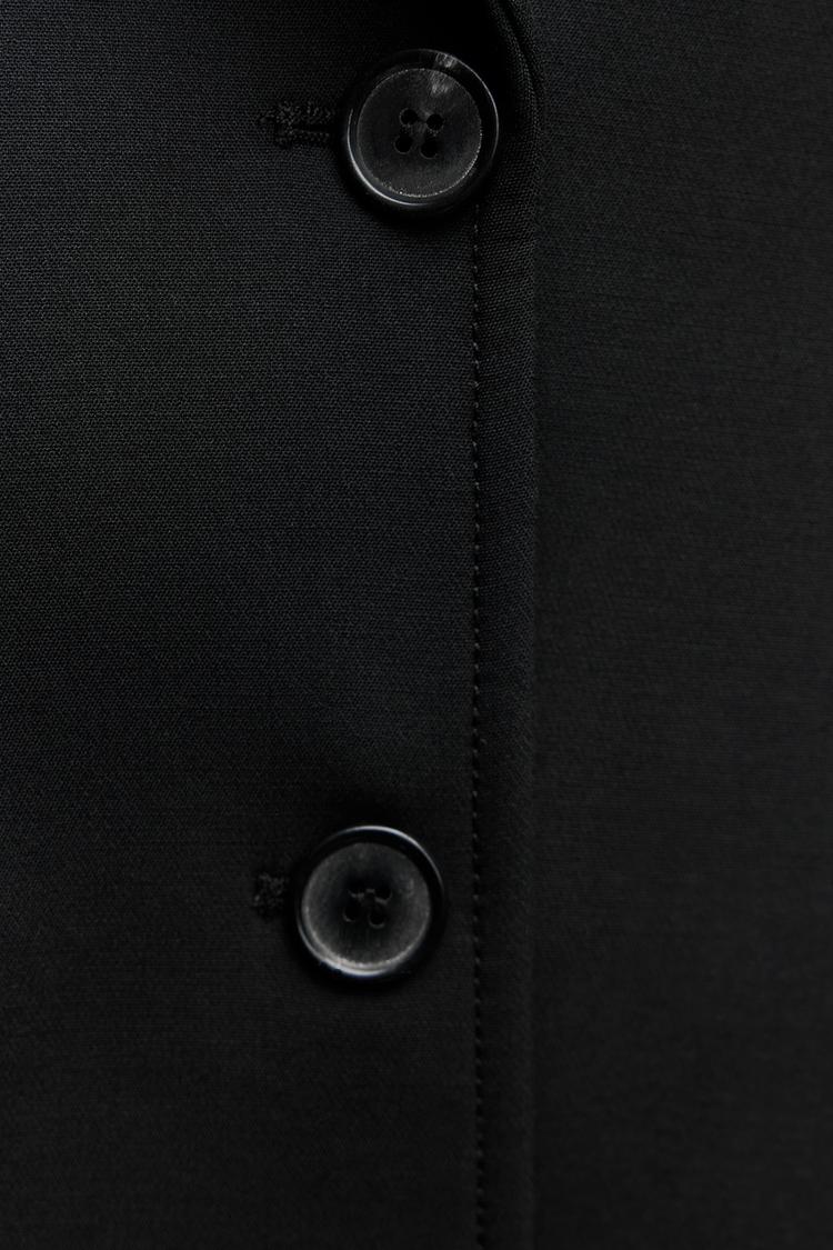 Manteau long croisé classique et chic 